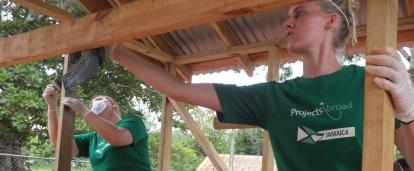 Projects Abroad volunteers building a playhouse for a local school as part of their building volunteer work in Jamaica A team from Projects Abroad take part in construction volunteering in Jamaica to build playhouse for local school